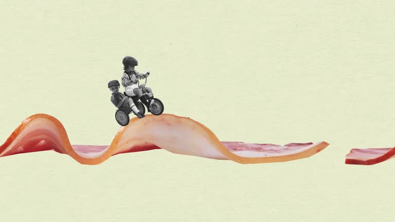 Stop motion, animation. Little boy, child riding bike on bacon. Delicious morning breakfast