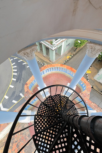 Cienfuegos, Cuba-October 11, 2019: Cast iron spiral staircase leading to the lookout atop the turret on the SE corner -Calles San Fernando and Bouyon Streets intersection- of the former Ferrer Palace.
