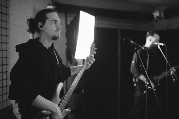 istock ock musicians with a guitar, rehearsal in the studio, black white 2150310812