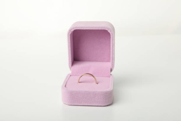 istock Wedding ring in pink case on white background, close up 2150311249