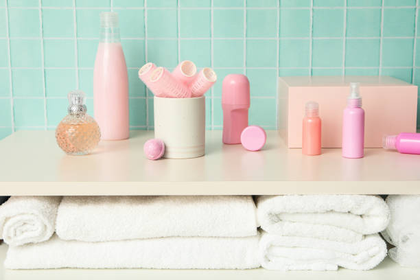A shelf in the bathroom with care products.