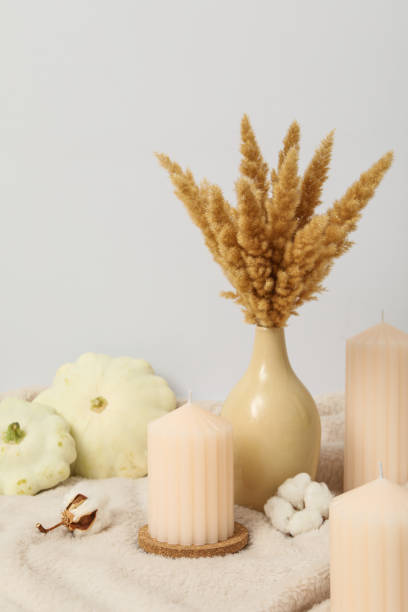 istock Candles, bouquet and zucchini on light background 2150314986