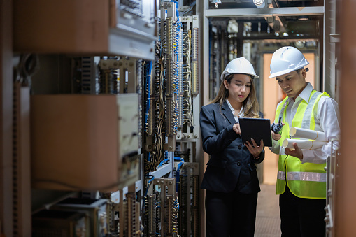 Male engineers oversee the intricate operations of the power plant, while female engineers contribute fresh perspectives and innovative solutions to enhance energy efficiency.