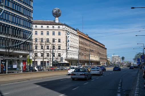 Sunday traffic in the center of Warsaw, in the background the historic Bracka 16 Orbis communist office building at Bracka street.