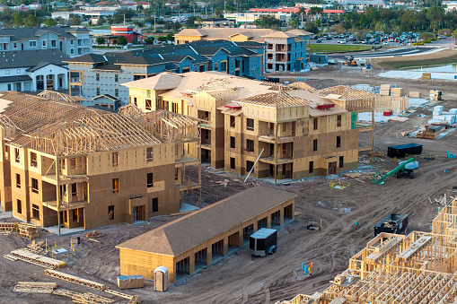 Wooden frames of new Florida apartment condos under construction. Development of residential housing in the USA.