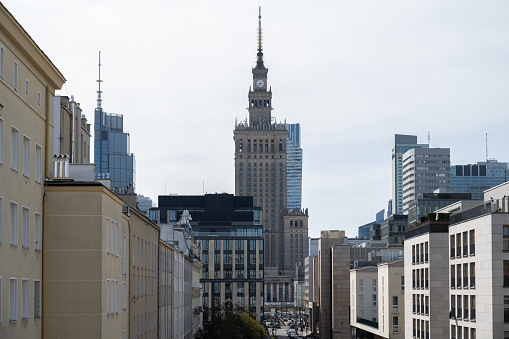Sunny day in Warsaw, view of the Palace of Culture and Science and residential buildings.