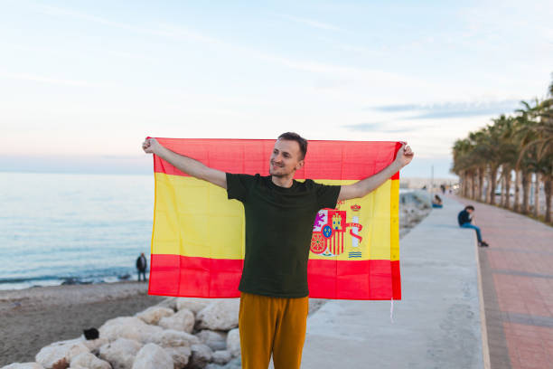 istock Young man walking with a Spanish flag outdoors 2150317771