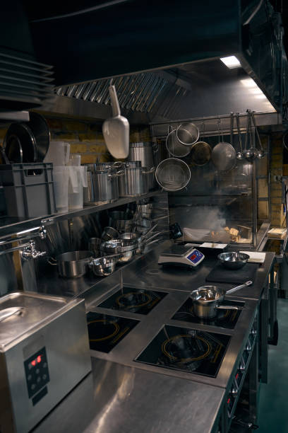 istock Interior of modern kitchen with burning fire in open stove in restaurant 2150321390