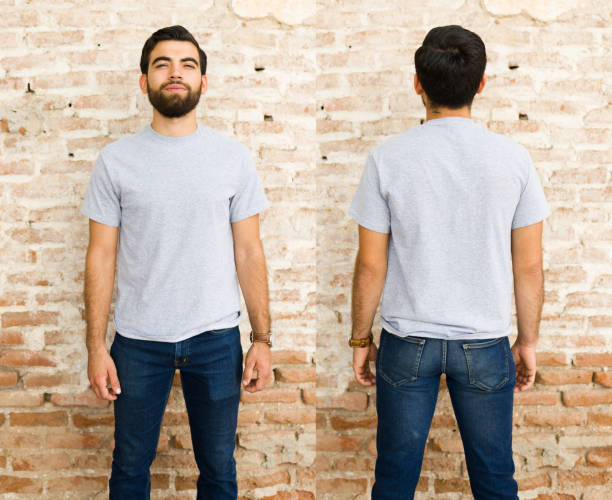 istock Smiling young hispanic man in a plain grey t-shirt for mock-up designs, shown from both front and back against a brick wall 2150321989