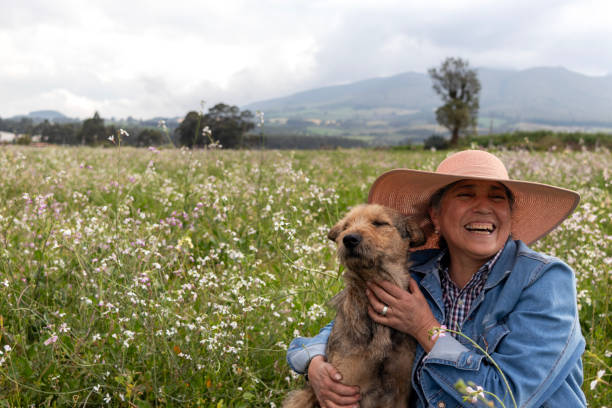 istock Woman laughing heartily while the dog looks disapproving 2150324556