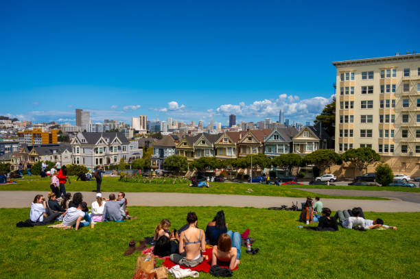 San Francisco Painted ladies house with skyline in background during springtime day.