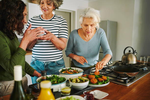 istock Mature women preparing dinner in the kitchen of their vacation accommodation 2150324730