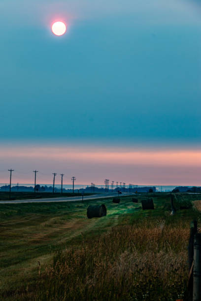 The sun rises over the praries on a fall morning, Rocky View County, Alberta, Canada