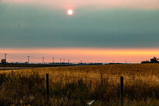 The sun rises over the praries on a fall morning, Rocky View County, Alberta, Canada