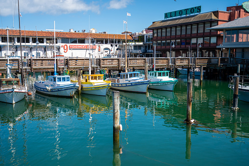 Fishing boats at fisherman's wharf in San Francisco during springtime day