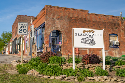 Blackwater, MO, USA - April 22, 2024: Street view and welcome sign to the the historic town of Blackwater.