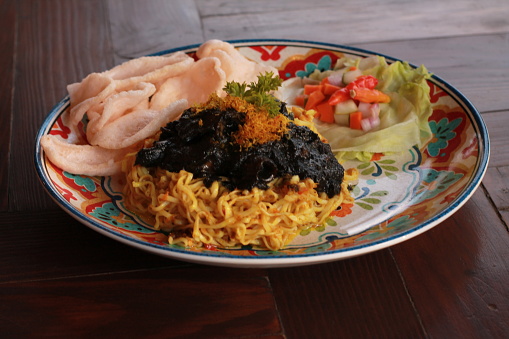 Fried Noodle served with Stir Fried Black Squid and Shrimp Crackers