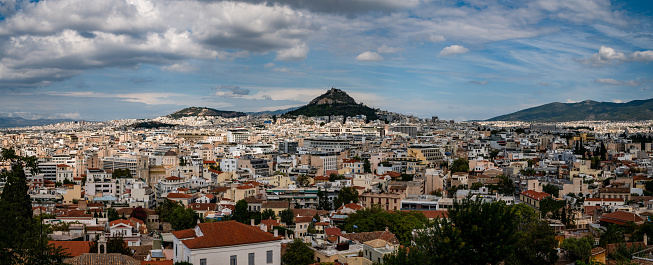 A panoramic view of the city with blue skies. Athens is one of the world's oldest cities. It's recorded history spanning around 3.400 years and it is being inhabited since the 11th millennium B.C. E.