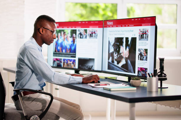 istock Reading News Article Headline On Laptop 2150331414