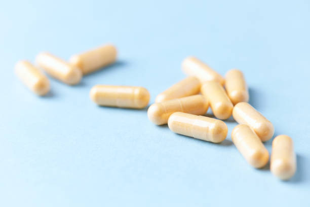 istock Coenzyme Q10 capsules. Dietary supplements. Bright paper background. Close up. 2150332533
