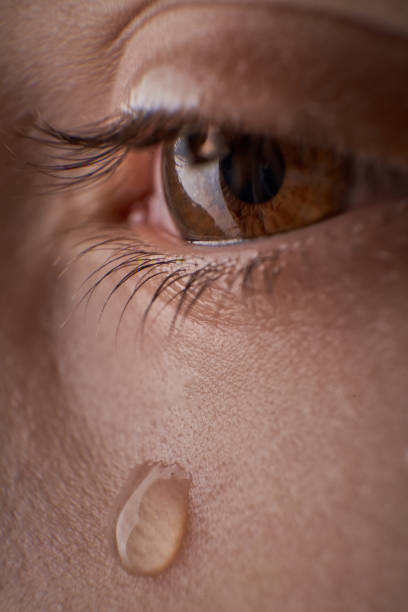 istock Eye of unrecognizable discontent kid with tear 2150334086