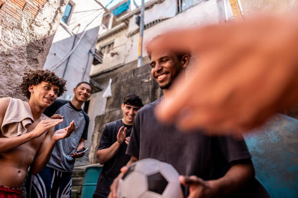 istock Young man dancing with his friends outdoors 2150334484