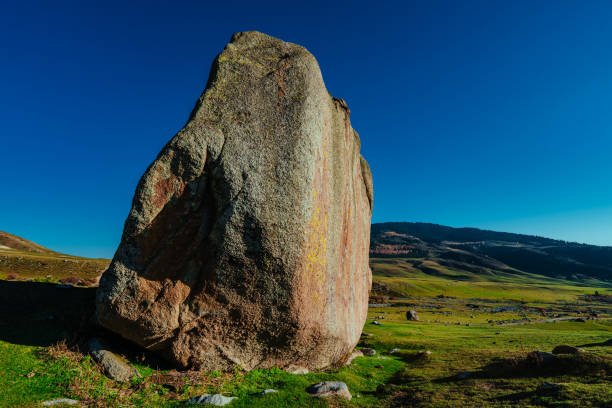 istock Large stone in a picturesque mountain valley in summer 2150335489