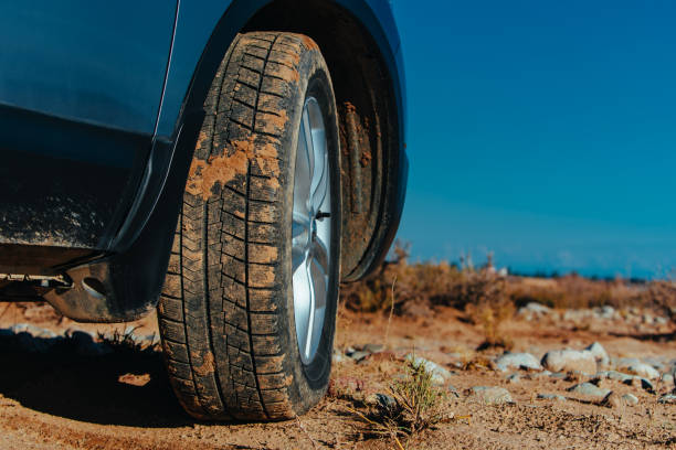 istock Car wheel with dirt off-road travel concept 2150336567
