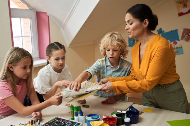 istock Happy children during art course in class room 2150338234