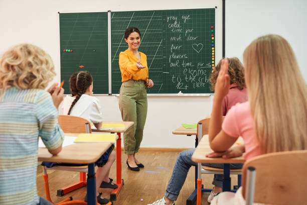 istock Pupils answering to teacher during english lesson 2150338292