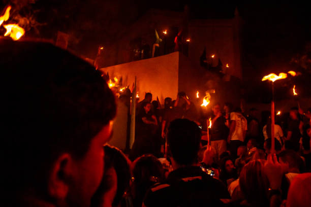 The explosion of firecrackers of different sizes during the Mascleta of Valencia, Spain