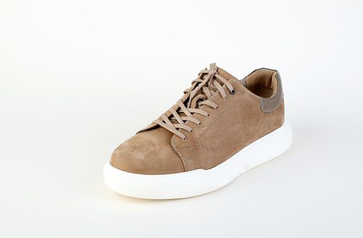 Comfortable suede shoe on white background