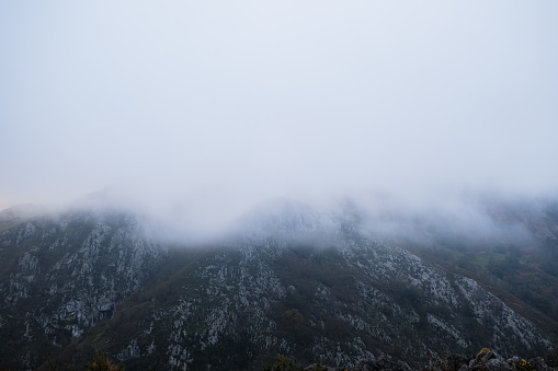 Dead city in fog and clouds. Khoba-Tele Ridge of Karadag Reserve in early spring . Crimea