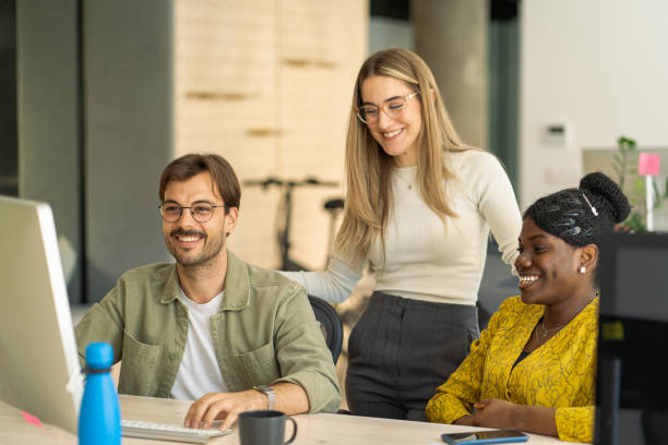 istock Three colleagues are talking about the designer project while looking at the monitor. 2150345670