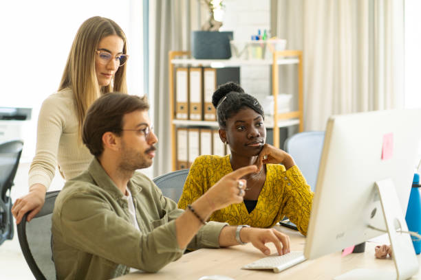 istock Three colleagues are talking about the designer project while looking at the monitor. 2150348176