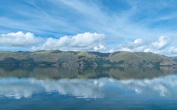 istock lagoon in the foreground with mountains with forests 2150350436