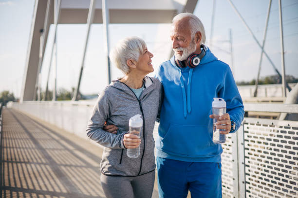 istock Romantic elderly couple spending some quality time together while walking on the bridge 2150350467
