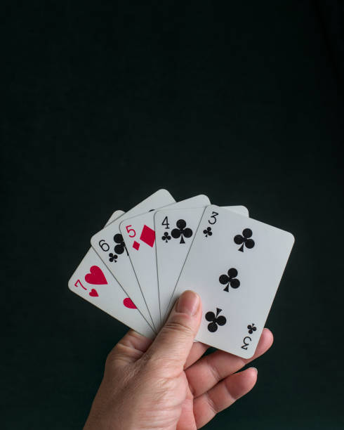 istock a hand holding a poker  Straight 2150350582
