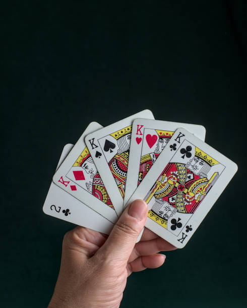 istock a hand holding a poker Four of a kind 2150350583