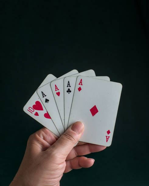 istock a hand holding a poker aces Four of a kind 2150350584
