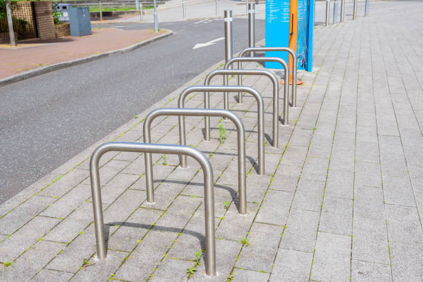 istock Empty steel bicycle racks on a pavement along  a street in a business district 2150351084