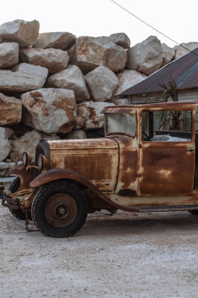 Abandoned Car On Land Against Sky