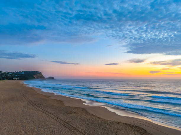 istock Hazy Summer Sunrise at the seaside with high cloud 2150351763