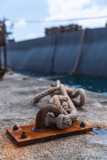istock The small old rusty boat mooring post at the harbor 2150352370
