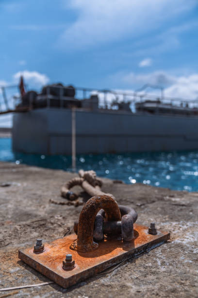 istock The small old rusty boat mooring post at the harbor 2150352423