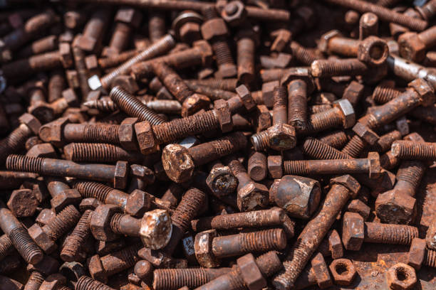 istock Rusty metal nuts and bolts 2150352430