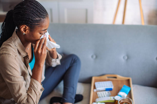 istock Woman with tissue and medication tray 2150353506