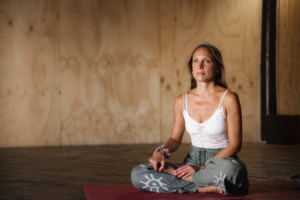 istock Woman seated in lotus posture 2150358092