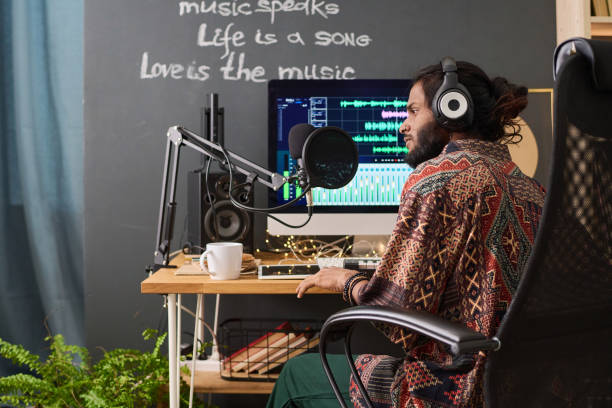 Young man working mixing at radio show