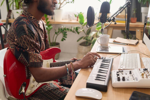 istock Guy creating new music and recording it 2150358450
